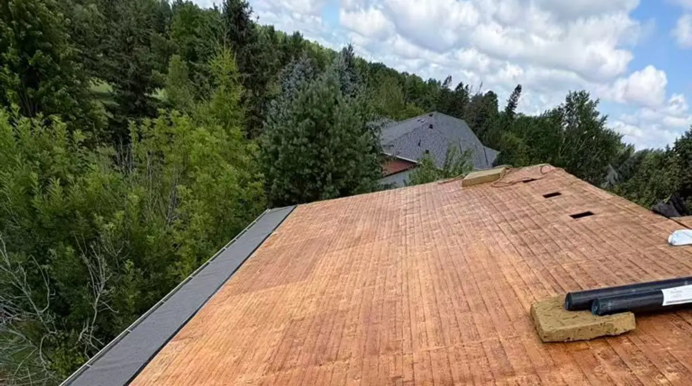 New plywood sheathing across the main slope of the Stouffville roof before the underlayment went down